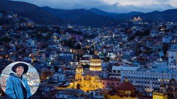 City scape of Guanajuato at dusk. A close-up picture of Zheyu Huang is overlayed in the bottom right corner.